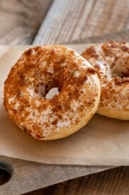 Donuts with Spiked Pumpkin Cream Cheese Frosting