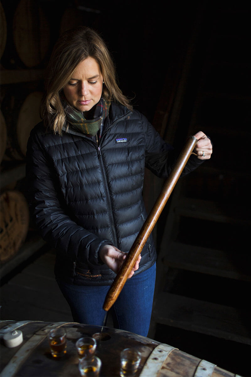 Elizabeth McCall working over a barrel in the Woodford Reserve distillery.