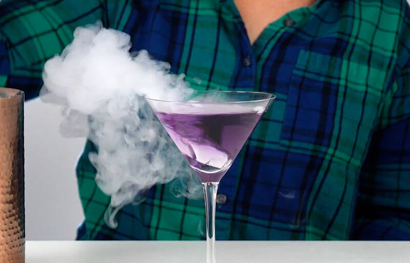 Dry ice in a purple martini