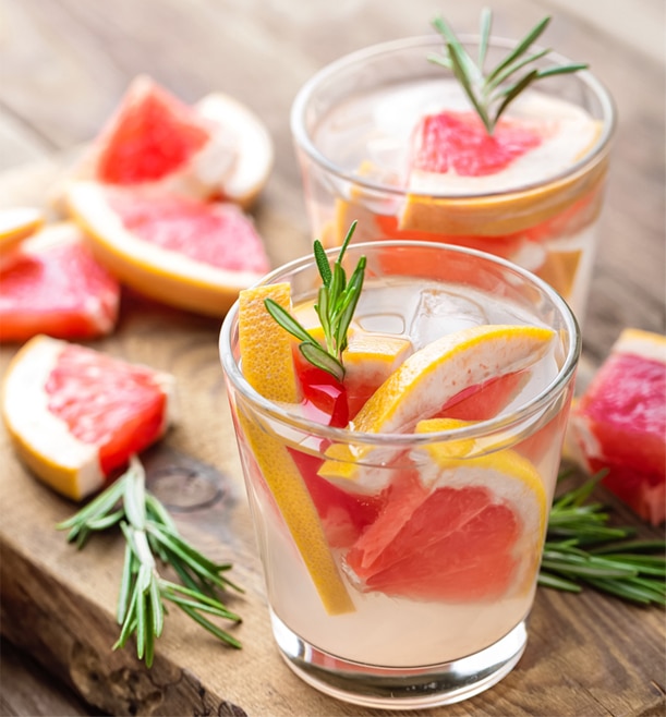  Grapefruit vodka and soda with grapefruit slices and rosemary as garnish.