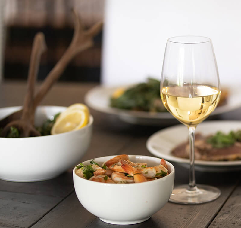 Seafood and light dishes paired with a glass of Pinot Grigio.