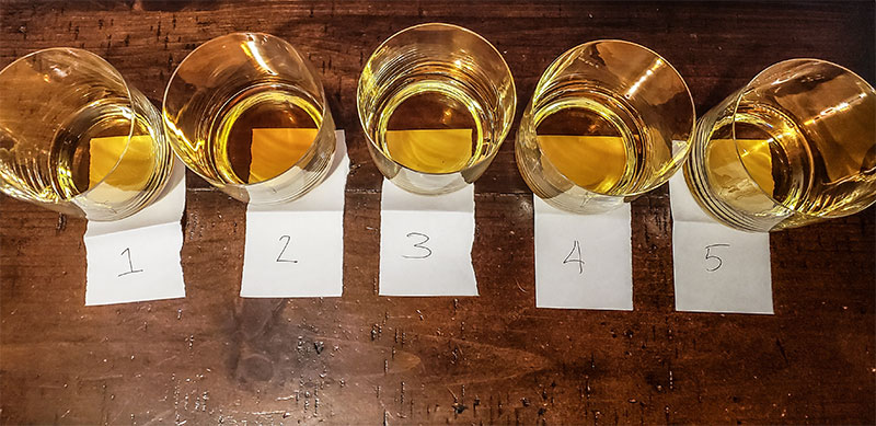 Five bourbons for a blind bourbon taste test.