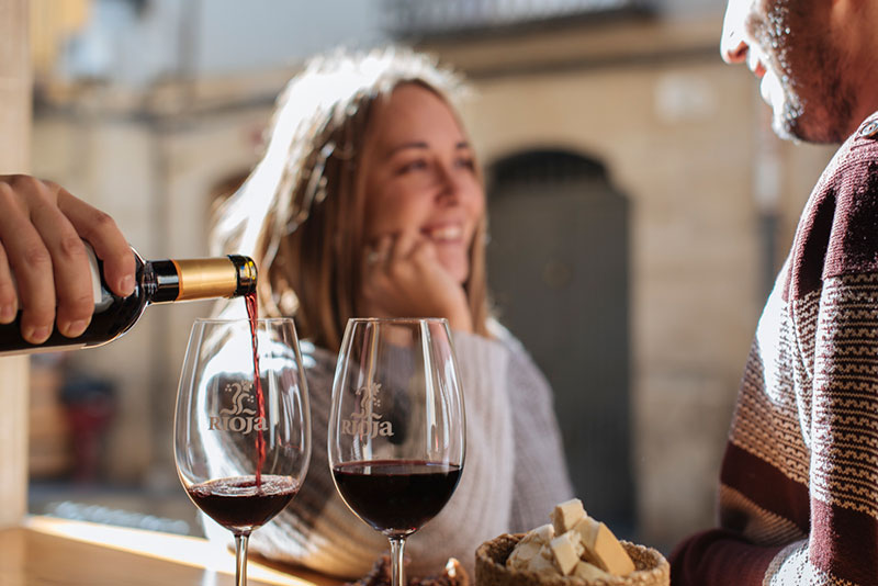 Two people enjoying wines from Rioja.